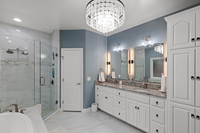 bathroom featuring vanity, plus walk in shower, and an inviting chandelier