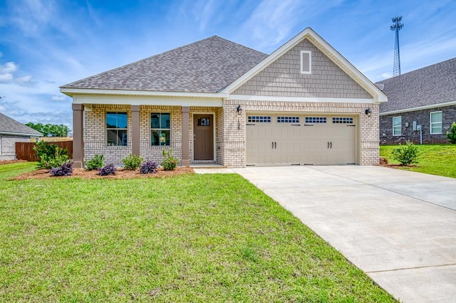 craftsman-style home with a garage, fence, concrete driveway, a front lawn, and brick siding