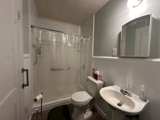 111 Helen St, Dothan, AL 36301 - full bathroom with a shower stall, toilet, a sink, and a wainscoted wall