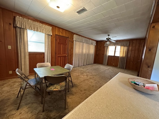 111 Helen St, Dothan, AL 36301 - carpeted dining space featuring wood walls and a ceiling fan