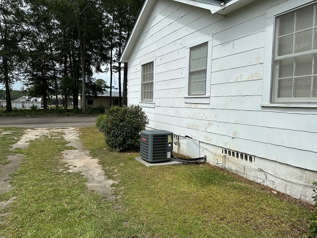 111 Helen St, Dothan, AL 36301 - view of side of property with cooling unit and a yard
