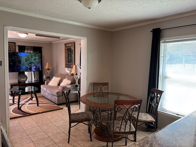 dining area featuring ornamental molding, light tile patterned flooring, and plenty of natural light