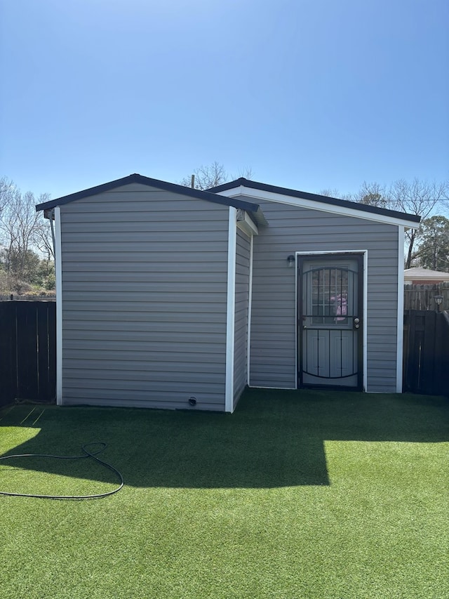 view of outdoor structure with fence