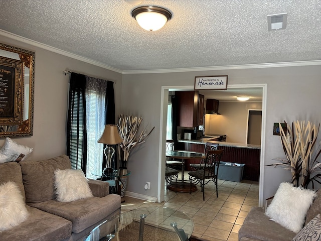 living room featuring crown molding, a textured ceiling, visible vents, baseboards, and light tile patterned flooring