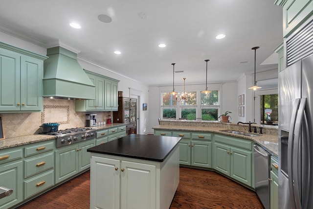 205 Marigold Ln, Dothan, AL 36305 - kitchen featuring stainless steel appliances, a sink, wall chimney exhaust hood, crown molding, and dark wood-style floors