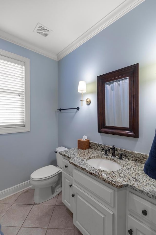 205 Marigold Ln, Dothan, AL 36305 - bathroom with vanity, ornamental molding, toilet, tile patterned floors, and baseboards