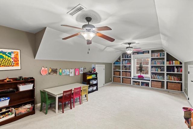 recreation room with ceiling fan, carpet, and lofted ceiling