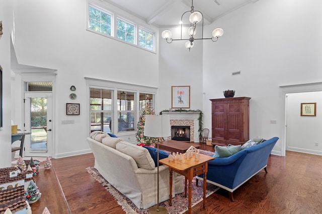 205 Marigold Ln, Dothan, AL 36305 - living area featuring wood finished floors, a fireplace, a high ceiling, baseboards, and plenty of natural light