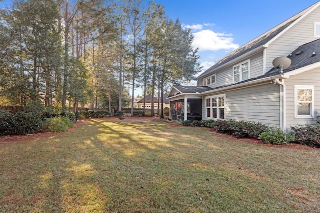 view of yard with a sunroom