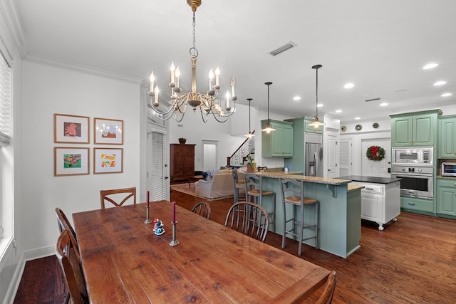 dining space featuring a chandelier, crown molding, and dark wood-type flooring