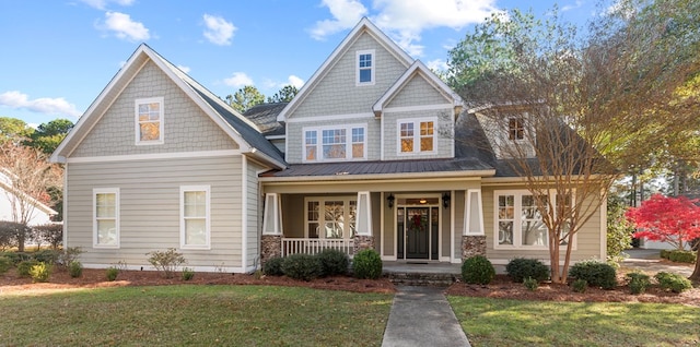 craftsman house featuring a front yard and a porch