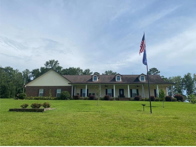 view of front facade with a front yard and covered porch