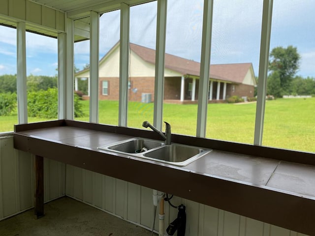 unfurnished sunroom with sink