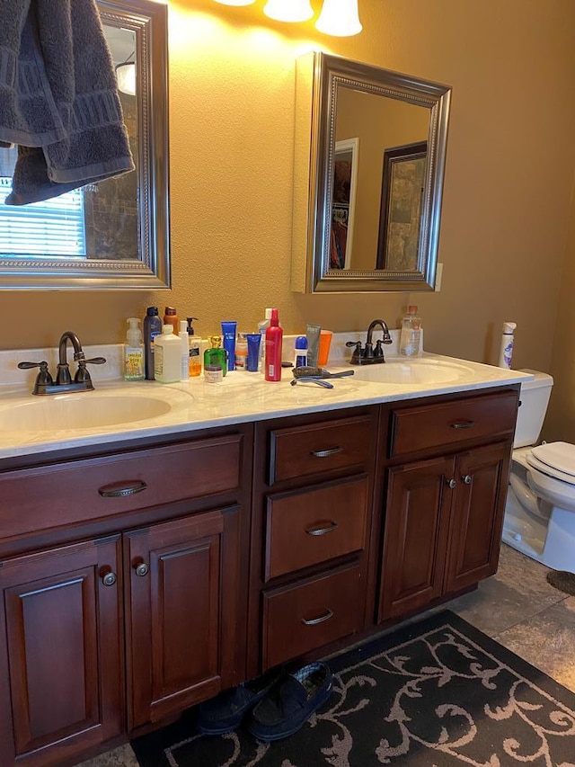 bathroom with vanity and toilet