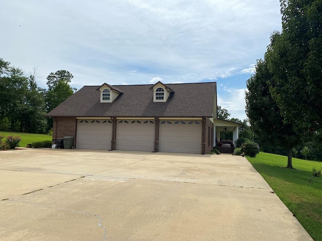 view of front of house with a garage and a front yard