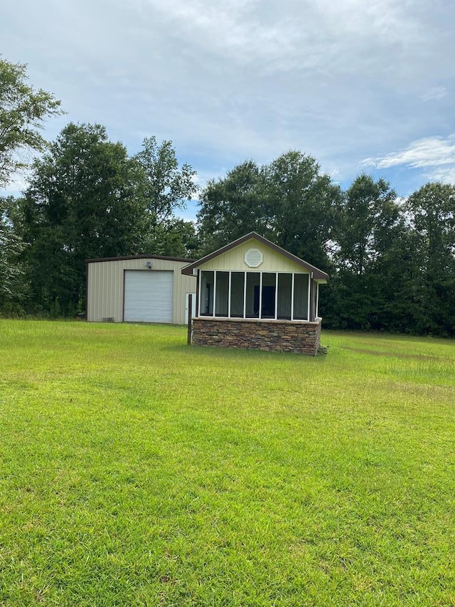 view of yard with an outbuilding and a garage