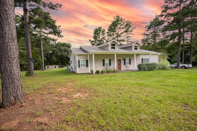 view of front facade with a lawn and a porch