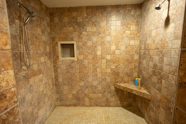 bathroom with a tile shower