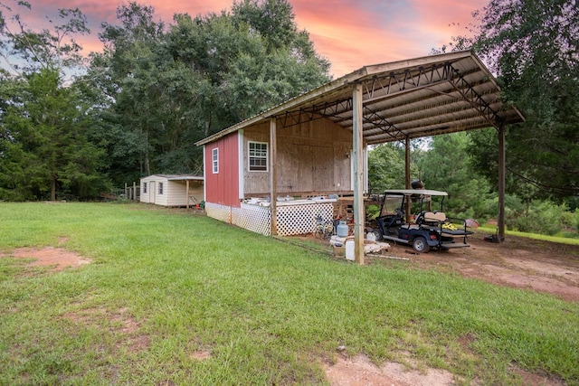 yard at dusk with an outbuilding