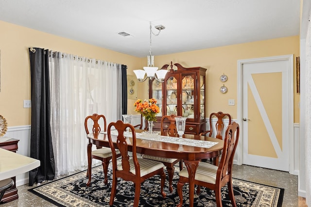 dining area with a chandelier