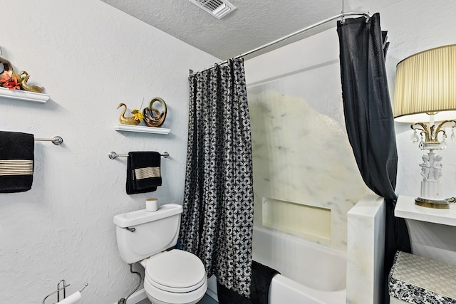 bathroom featuring shower / bath combo, a textured ceiling, and toilet