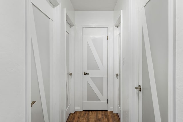 hallway with dark hardwood / wood-style flooring