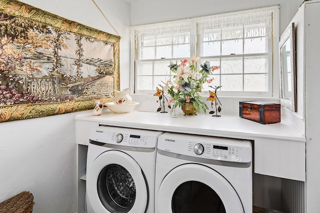 washroom featuring washing machine and dryer