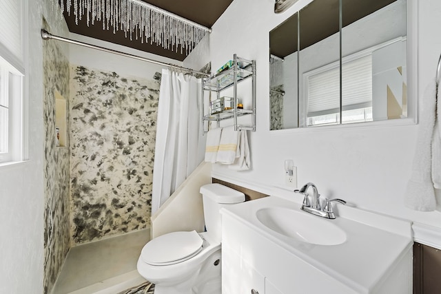 bathroom with a shower with curtain, vanity, toilet, and plenty of natural light