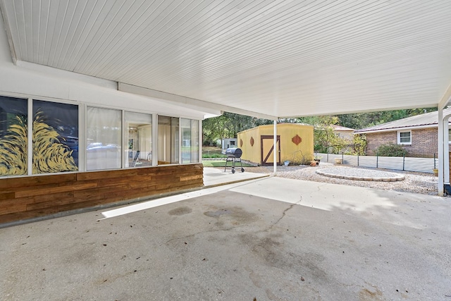 view of patio / terrace featuring a storage unit