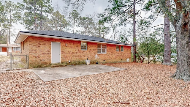 back of house with a patio