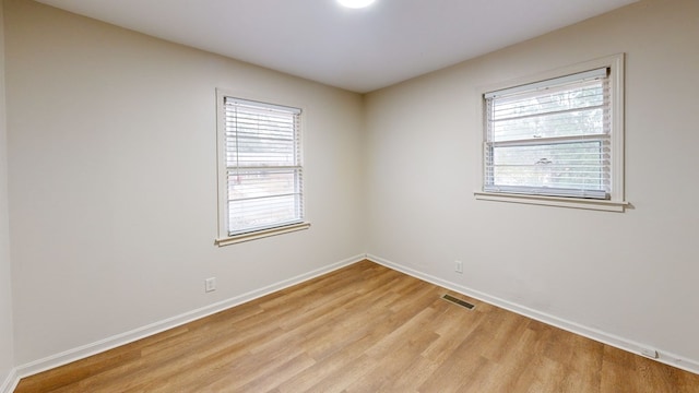 empty room with light wood-type flooring