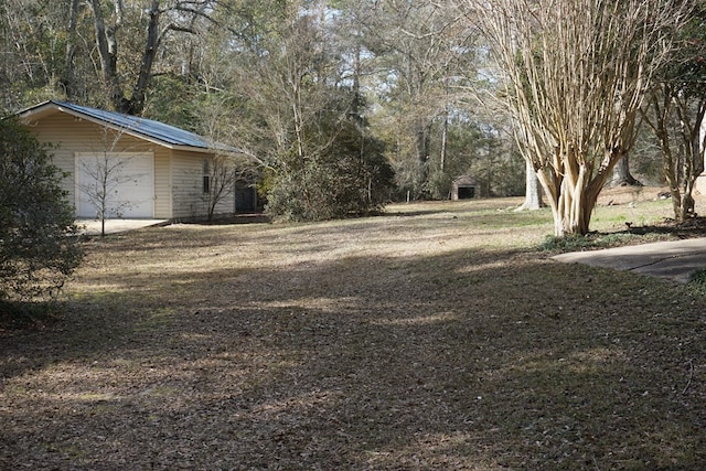 view of yard featuring a garage