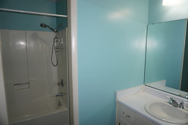 bathroom featuring shower / bathtub combination and vanity