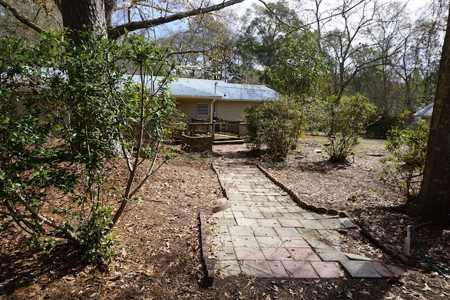 view of yard featuring a wooden deck