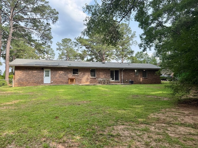 1002 Monterey Ct, Dothan, AL 36303 - rear view of property with a yard and brick siding