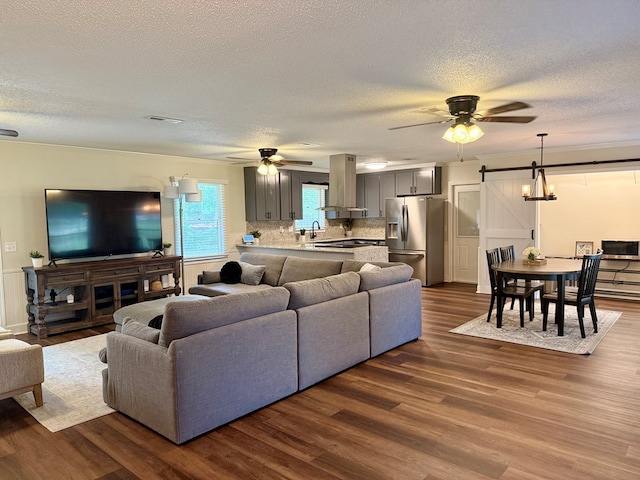 1002 Monterey Ct, Dothan, AL 36303 - living room with ceiling fan, dark wood-style flooring, and a textured ceiling