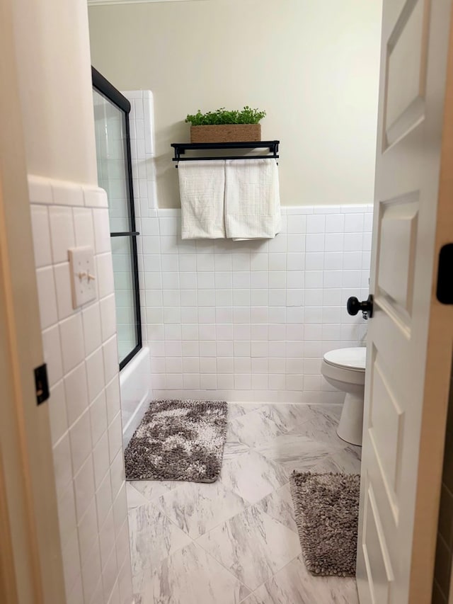 1002 Monterey Ct, Dothan, AL 36303 - full bath with tile walls, a wainscoted wall, toilet, marble finish flooring, and enclosed tub / shower combo