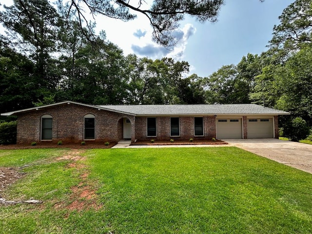 1002 Monterey Ct, Dothan, AL 36303 - single story home with an attached garage, brick siding, and driveway