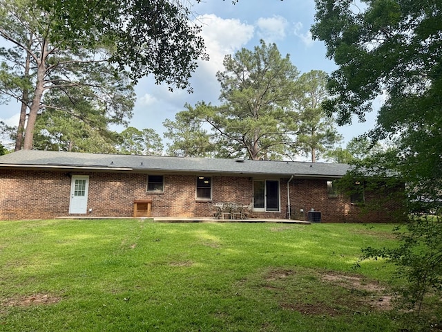 1002 Monterey Ct, Dothan, AL 36303 - back of property featuring a yard, brick siding, and central AC unit