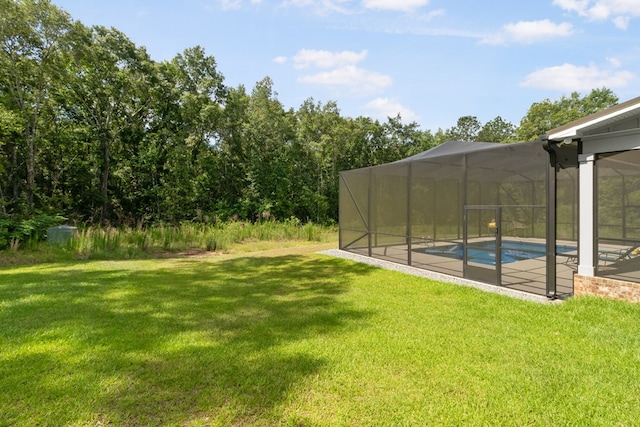 1913 W Malvern Hwy, Slocomb, AL 36375 - view of grassy yard with an outdoor pool, a patio, and a lanai