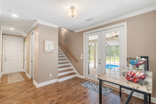 1913 W Malvern Hwy, Slocomb, AL 36375 - entryway featuring baseboards, wood finished floors, crown molding, french doors, and stairs