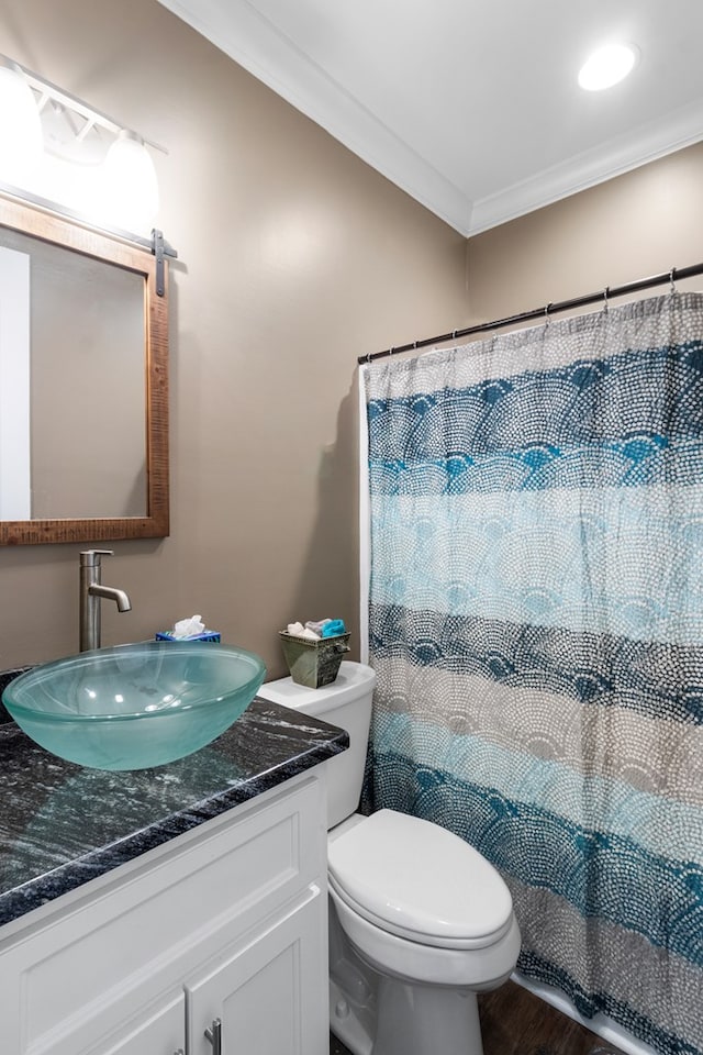 1913 W Malvern Hwy, Slocomb, AL 36375 - full bath featuring crown molding, vanity, toilet, wood finished floors, and a shower with curtain