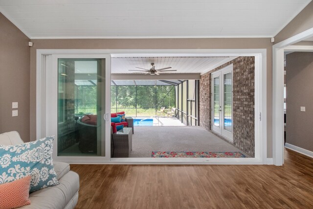 1913 W Malvern Hwy, Slocomb, AL 36375 - living room featuring a sunroom, wood finished floors, ceiling fan, and baseboards