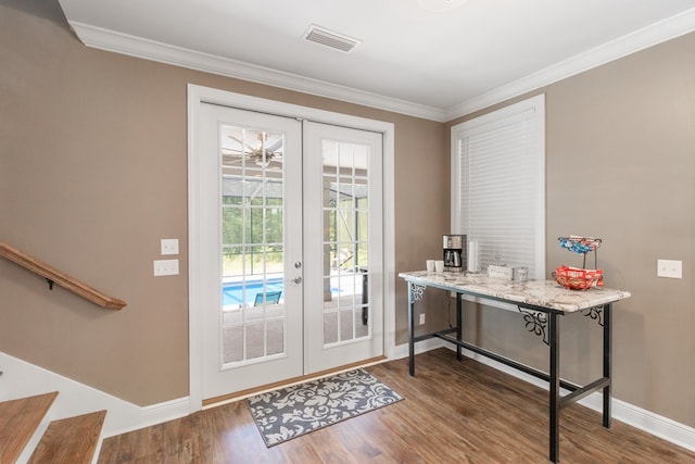 1913 W Malvern Hwy, Slocomb, AL 36375 - entryway featuring french doors, baseboards, crown molding, wood finished floors, and stairs