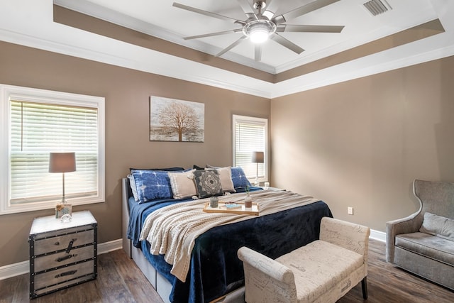 1913 W Malvern Hwy, Slocomb, AL 36375 - bedroom featuring a raised ceiling, dark wood finished floors, baseboards, ornamental molding, and ceiling fan