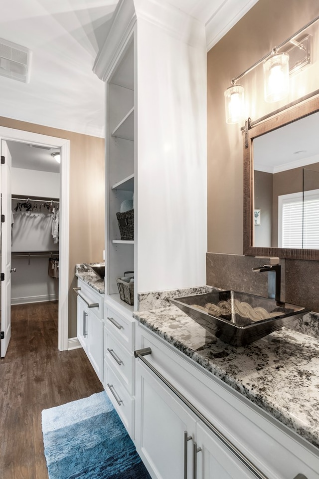 1913 W Malvern Hwy, Slocomb, AL 36375 - full bath with vanity, ornamental molding, wood finished floors, and a spacious closet