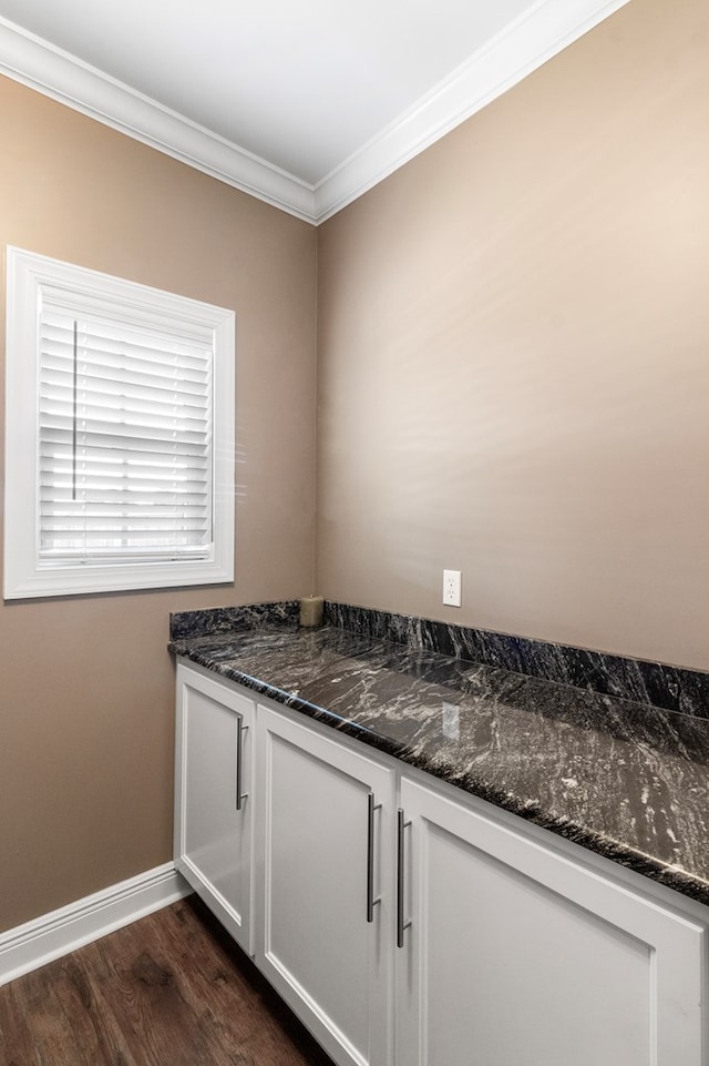 1913 W Malvern Hwy, Slocomb, AL 36375 - bar with crown molding, dark wood-style floors, and baseboards