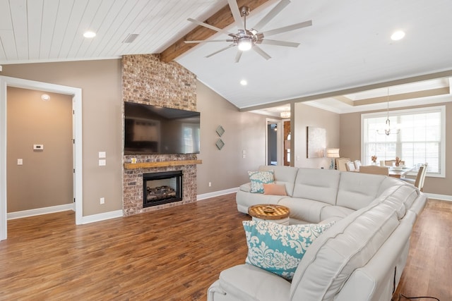 1913 W Malvern Hwy, Slocomb, AL 36375 - living room featuring wood finished floors, a ceiling fan, baseboards, a fireplace, and recessed lighting