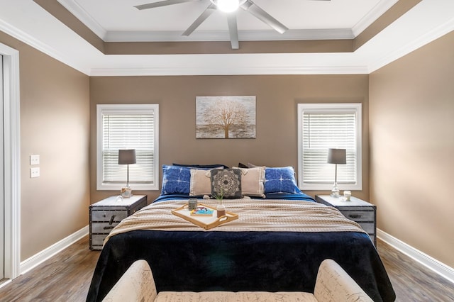 1913 W Malvern Hwy, Slocomb, AL 36375 - bedroom with a raised ceiling, wood finished floors, multiple windows, baseboards, and ornamental molding