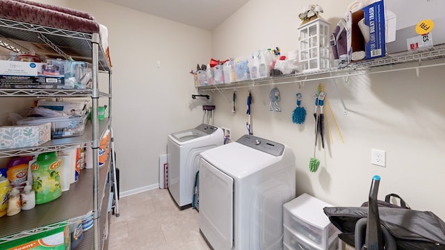 clothes washing area with separate washer and dryer